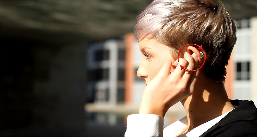 T5-True-Wireless-earphones-woman-fitting-earphone-in-ear.jpg